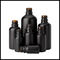 Cosmético helado negro de las botellas de cristal del aceite esencial del color que empaqueta forma redonda proveedor