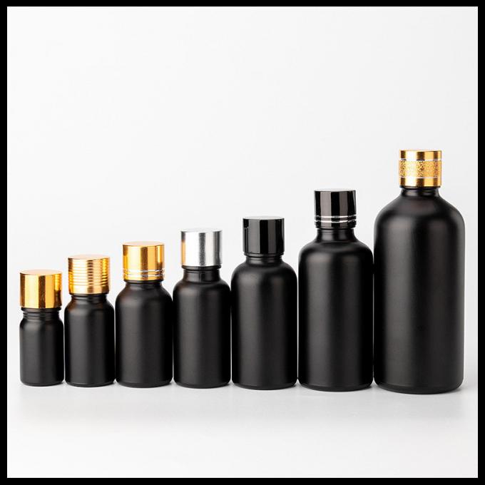 Cosmético helado negro de las botellas de cristal del aceite esencial del color que empaqueta forma redonda